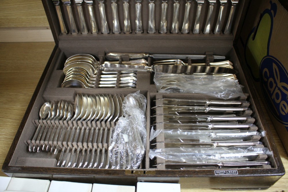 A Mappin & Webb oak cased canteen of plated flatware and cutlery for eight, with additional individually boxed items